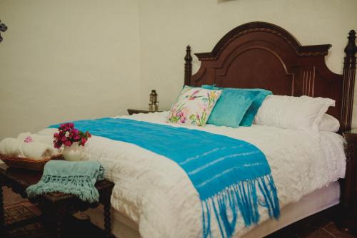 Una cama o camas en una habitación de Hacienda de Comodejé