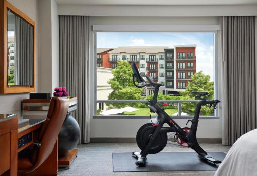 a room with a bike in front of a window at The Westin Austin at The Domain in Austin