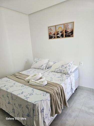 Ένα ή περισσότερα κρεβάτια σε δωμάτιο στο Hospedagens Rebouças