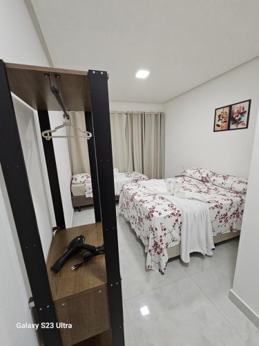 Ένα ή περισσότερα κρεβάτια σε δωμάτιο στο Hospedagens Rebouças