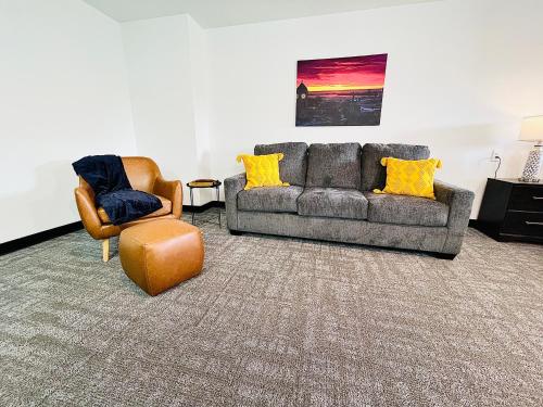 a living room with a couch and two chairs at The 419 Ten-room Boutique In Sandusky in Sandusky