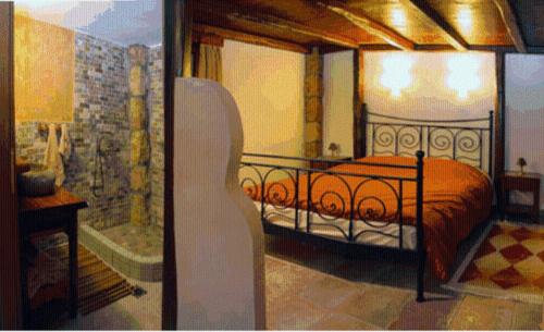 a bedroom with a bed in a room at Apolithomeno Dasos Holiday Villas near Alexandroupolis in Lefkimmi
