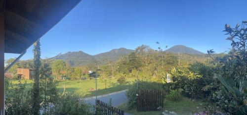 a view of the mountains from a house at Kakao Lodge & Garden Río Celeste in Bijagua