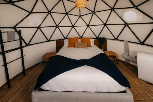 a bedroom with a large bed in a triangular room at Casa Castillo Condesa in Mexico City
