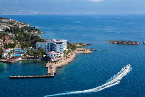 an aerial view of a boat in a body of water at Le Bleu Hotel & Resort Kusadasi in Kusadası