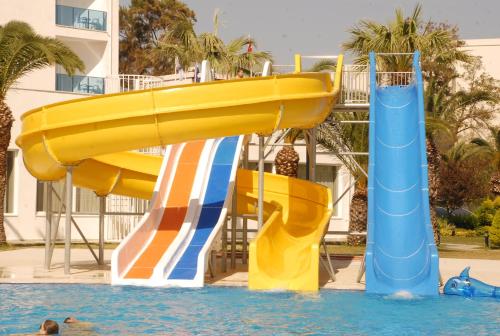 a water slide in a swimming pool at Le Bleu Hotel & Resort Kusadasi in Kusadası
