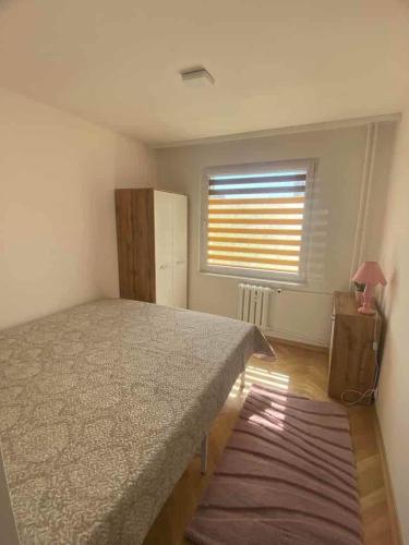 Postel nebo postele na pokoji v ubytování Gdynia Mieszkanie z Biurem