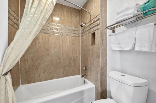 Koupelna v ubytování Executive Inn