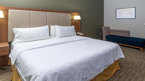 a large white bed in a hotel room at Holiday Inn Express Mexico Santa Fe by IHG in Mexico City