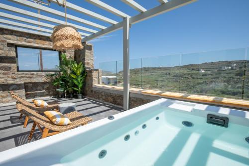 a swimming pool in a house with a view at SilvAir by Silvernoses, Mykonos in Dexamenes