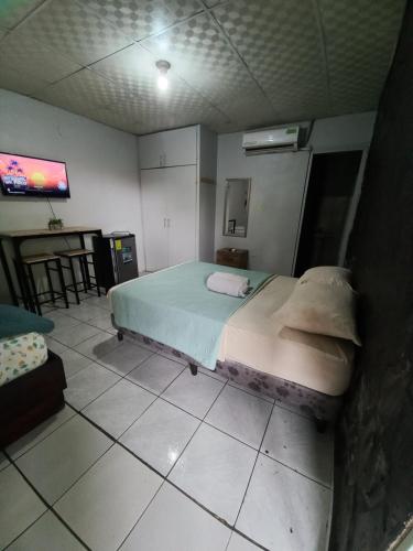 Un ou plusieurs lits dans un hébergement de l'établissement Apartahotel los cactus