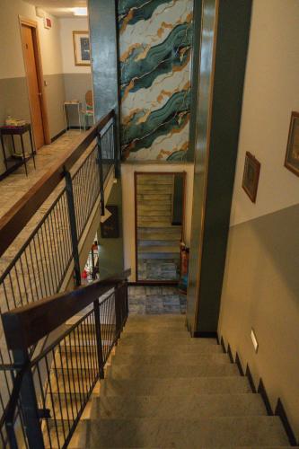 a stairway with a painting on the wall at Hotel Magnolia in Albenga