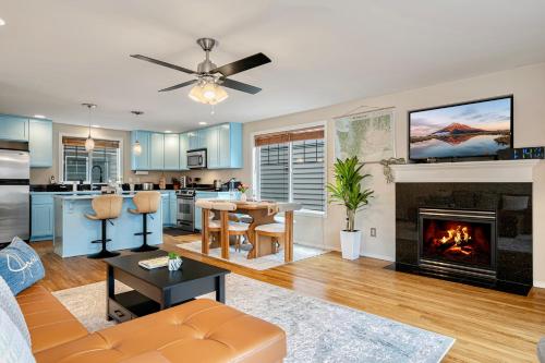 a living room with a couch and a fireplace at Modern Luxury Home, Green Lake, Seattle in Seattle