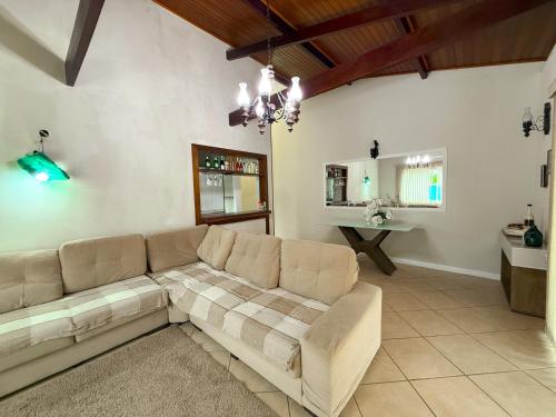 a living room with a couch and a table at House Condominium Pier 51 in Saí