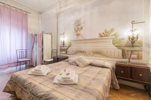 Giường trong phòng chung tại Suites Piazza Del Popolo