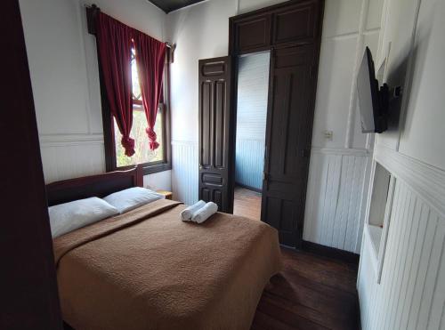 Una cama o camas en una habitación de Casa Aldea Hotel Bed & Breakfast