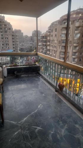 a balcony of a building with a view of a city at شقق Hs 4 in Cairo