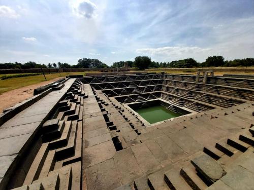 a large amphitheater with a hole in the ground at Archana palace hampi in Hampi
