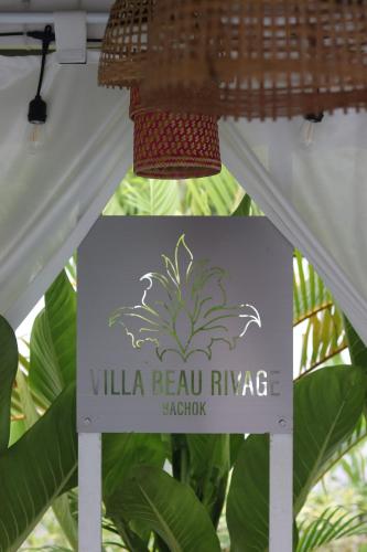 a sign that reads villa bella bella rave acacia at Villa Beau Rivage in Bachok