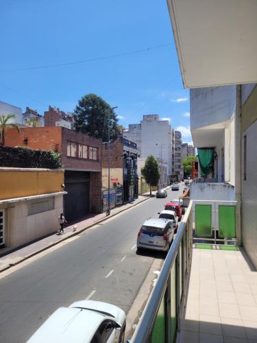 a city street with cars parked on the side of the road at HOTEL RESIDENCIAL CAMACHO in Cordoba