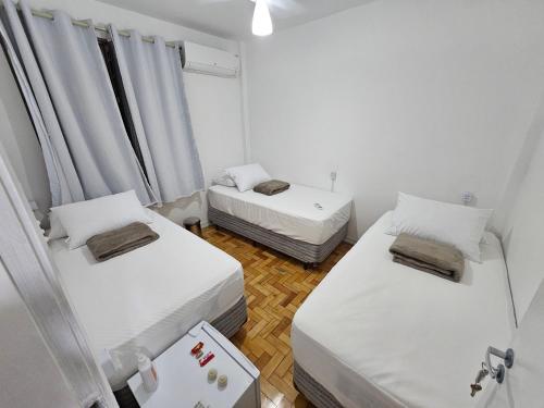 Ένα ή περισσότερα κρεβάτια σε δωμάτιο στο Quarto Privativo em Condominio