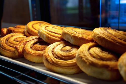 a pile of pastries sitting on top of a tray at Elite Suites Patong in Patong Beach