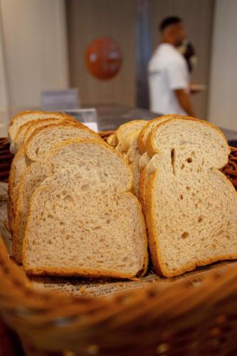 a group of slices of bread in a basket at Elite Suites Patong in Patong Beach