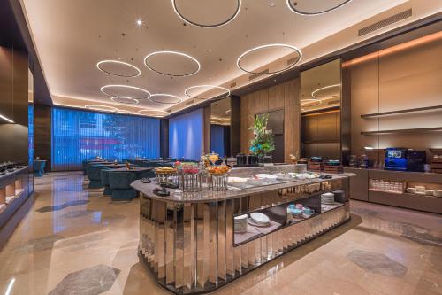 Posezení v ubytování Yangjiang Jiangcheng Jinshang Road Orange Crystal Hotel