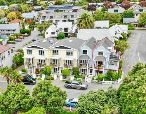 an aerial view of a city with houses at Waterfront Akaroa Retreat with Harbour Views & Balcony in Akaroa