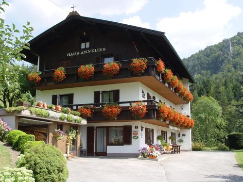 a building with flower boxes on the balconies at Haus Annelies Walchsee in Walchsee