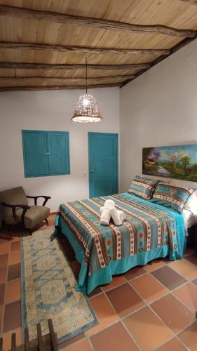 En eller flere senge i et værelse på Hotel Boutique Campestre El Ensueño