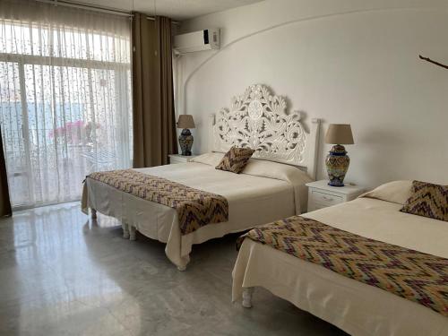 Postel nebo postele na pokoji v ubytování Hermoso condominio en Bahía Manzanillo