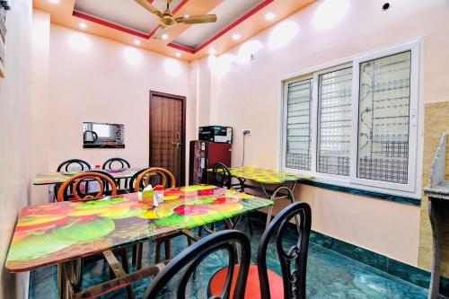 a dining room with a table and chairs at HOTEL KANAN INN in kolkata