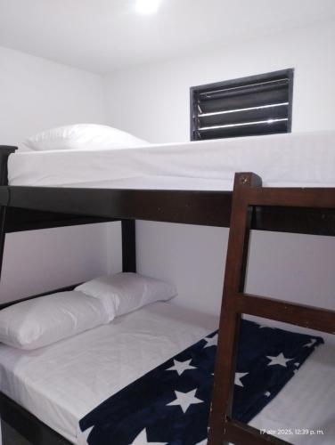Postel nebo postele na pokoji v ubytování Casa Hévenie, Hospedaje familiar cómodo y bien ubicado
