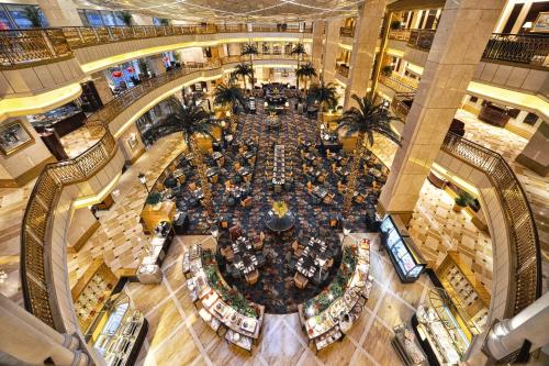 an overhead view of a shopping mall with a large crowd of people at Grand Central Hotel Shanghai - Nanjing Road in Shanghai
