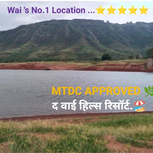 a picture of a lake with mountains in the background at The Wai Hills MTDC Approved in Wai