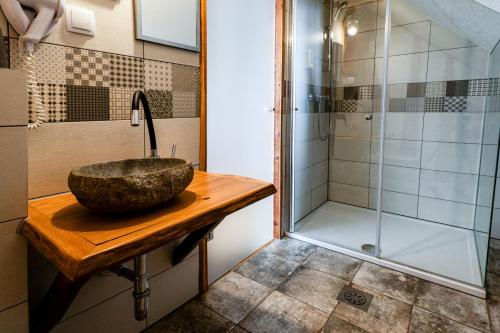 a bathroom with a sink and a shower at Turistična kmetija Grabnar in Bled