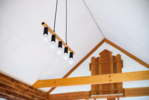 a chandelier hanging from the ceiling of a room at Turistična kmetija Grabnar in Bled