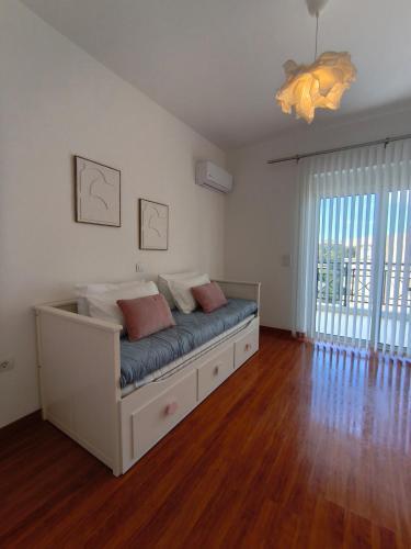 a bedroom with a bed with pillows on it at Downtown Luxury Apartment in Rhodes Town