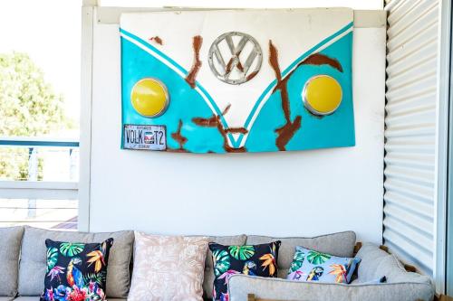 a living room with a couch and a picture on the wall at Dinga Coastal Hamptons style in Aldinga Beach