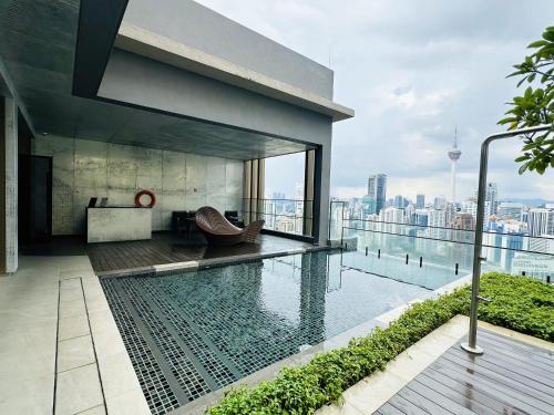 a swimming pool on the roof of a building at The Axon Suites Pro Max in Kuala Lumpur