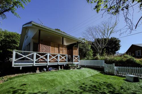 a small house with a porch and a fence at Marine Villa Ilio in Sumoto