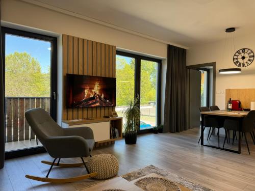 TV a/nebo společenská místnost v ubytování Apartment Timo Bešeň 209