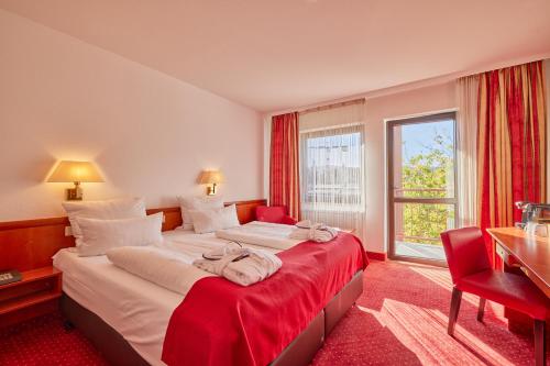 Postel nebo postele na pokoji v ubytování Mercure Hotel Bad Duerkheim An Den Salinen