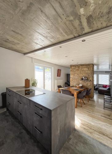 a kitchen and dining room with a table in a room at Ferienwohnung Hegau Bodensee in Rielasingen-Worblingen
