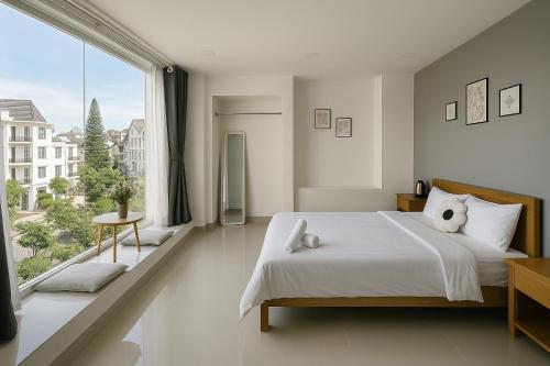 Postel nebo postele na pokoji v ubytování LAM ANH Hotel