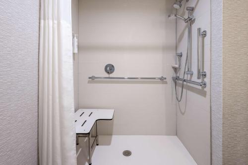 a white bathroom with a shower and a sink at Hampton Inn & Suites Venice Bayside South Sarasota in Venice