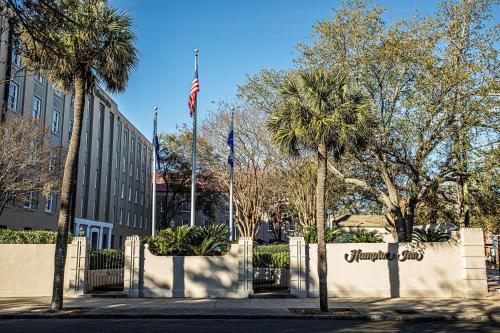 an american flag flying in front of a building at Hampton Inn Charleston-Historic District in Charleston