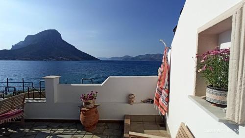 a balcony with a view of the water at Aegean Villita on beach apartment in Kalymnos