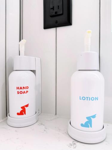 two bottles of hand sanitizer sitting on a counter at The Alice Hotel in Tucson